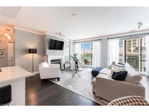 Ph404-88 Palace Pier Court, Toronto, ON - Indoor Photo Showing Living Room With Fireplace