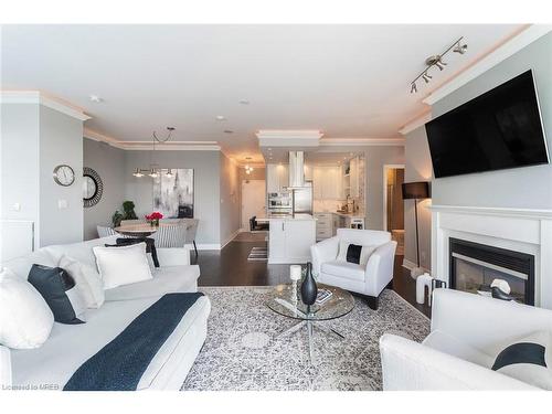 Ph404-88 Palace Pier Court, Toronto, ON - Indoor Photo Showing Living Room With Fireplace