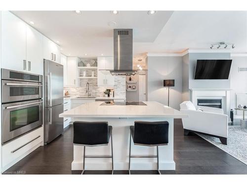 Ph404-88 Palace Pier Court, Toronto, ON - Indoor Photo Showing Kitchen With Fireplace With Upgraded Kitchen