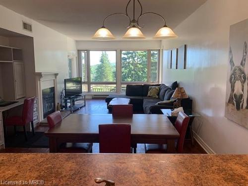 2-3111 Grandview Forest Hill Drive, Huntsville, ON - Indoor Photo Showing Dining Room With Fireplace