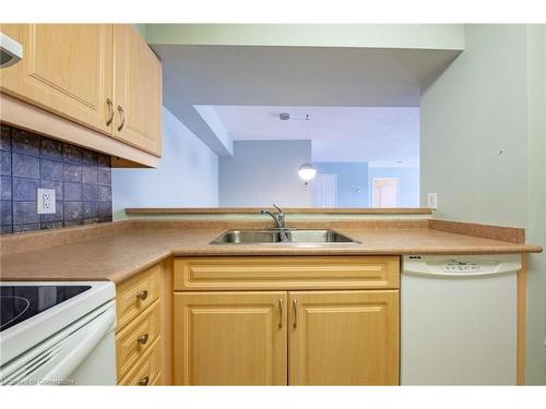 208-333 Lafontaine Road W, Tiny, ON - Indoor Photo Showing Kitchen With Double Sink