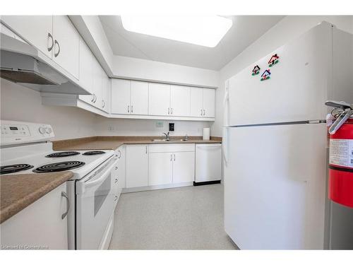 208-333 Lafontaine Road W, Tiny, ON - Indoor Photo Showing Kitchen With Double Sink