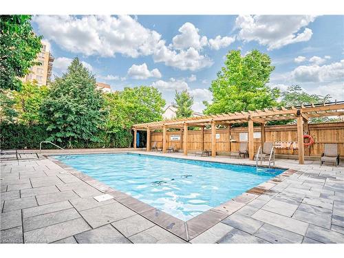 412-2365 Central Park Drive, Oakville, ON - Outdoor With In Ground Pool