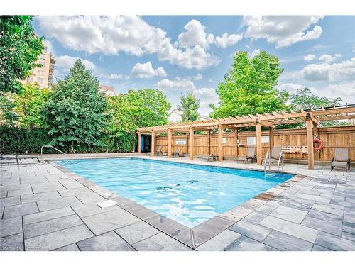 1107-2365 Central Park Drive, Oakville, ON - Outdoor With In Ground Pool