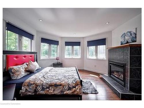 314 Golf Course Road, Simcoe, ON - Indoor Photo Showing Bedroom With Fireplace