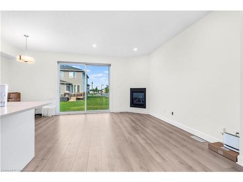 353 Buckthorn Drive Drive, Kingston, ON - Indoor Photo Showing Other Room With Fireplace