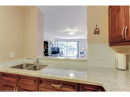 312-2177 Burnhamthorpe Road W, Mississauga, ON - Indoor Photo Showing Kitchen With Double Sink