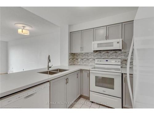 711-2177 Burnhamthorpe Road W, Mississauga, ON - Indoor Photo Showing Kitchen With Double Sink