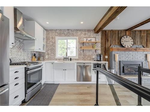 16 William Avenue, Wasaga Beach, ON - Indoor Photo Showing Kitchen With Fireplace With Upgraded Kitchen