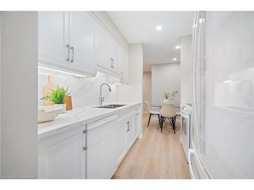 207-2055 Walkers Line, Burlington, ON - Indoor Photo Showing Kitchen With Double Sink