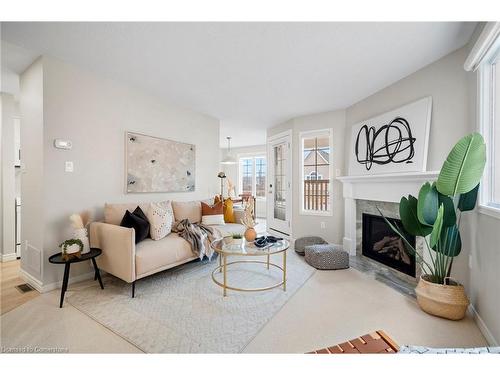 207-2055 Walkers Line, Burlington, ON - Indoor Photo Showing Living Room With Fireplace