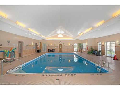 28-11 Twentyplace Boulevard, Mount Hope, ON - Indoor Photo Showing Other Room With In Ground Pool