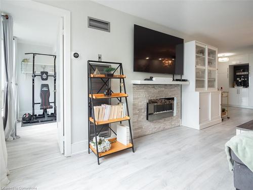 1601-3 Hickory Tree Road, Toronto, ON - Indoor Photo Showing Living Room With Fireplace