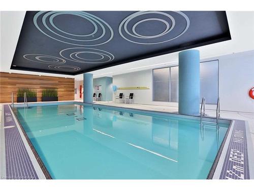 708-55 Speers Road, Oakville, ON - Indoor Photo Showing Other Room With In Ground Pool