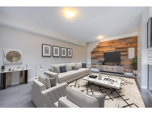 F2-70 Willowrun Drive, Kitchener, ON - Indoor Photo Showing Living Room With Fireplace