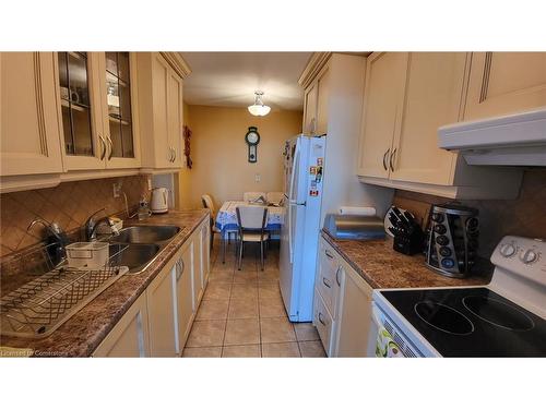 912-5 Frith Road, Toronto, ON - Indoor Photo Showing Kitchen With Double Sink