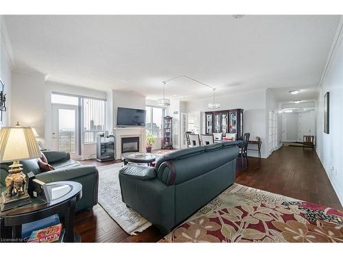 2808-25 Kingsbridge Garden Circle, Mississauga, ON - Indoor Photo Showing Living Room With Fireplace