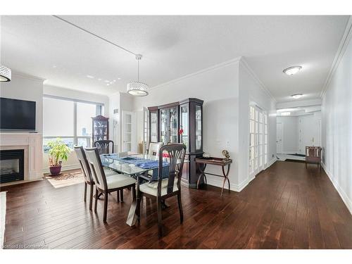 2808-25 Kingsbridge Garden Circle, Mississauga, ON - Indoor Photo Showing Dining Room With Fireplace