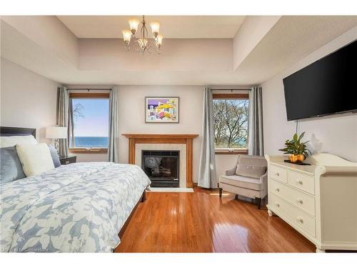 327A Lake Promenade, Toronto, ON - Indoor Photo Showing Bedroom With Fireplace