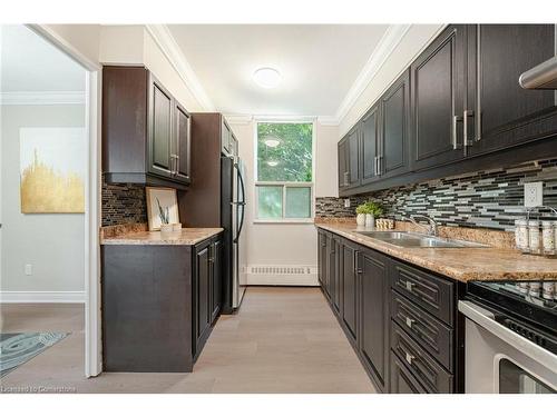 319-551 The West Mall, Toronto, ON - Indoor Photo Showing Kitchen With Double Sink