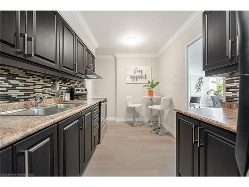 319-551 The West Mall, Toronto, ON - Indoor Photo Showing Kitchen With Double Sink