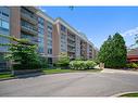 1215-100 Burloak Drive, Burlington, ON  - Outdoor With Balcony With Facade 