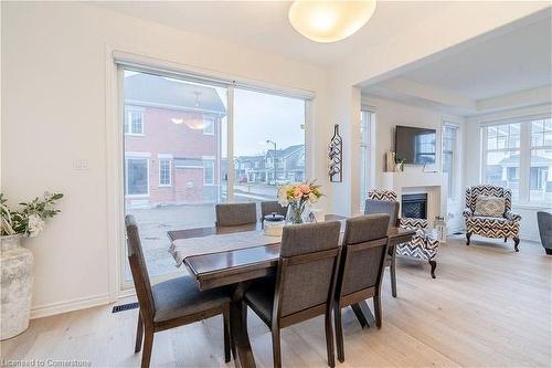 3 Milt Schmidt Street, Kitchener, ON - Indoor Photo Showing Dining Room With Fireplace