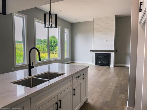 6264 Line 5 N, Oro-Medonte, ON - Indoor Photo Showing Kitchen With Fireplace With Double Sink