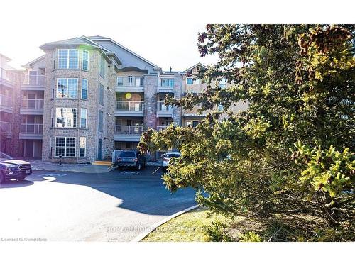 306-1450 Bishops Gate, Oakville, ON - Outdoor With Balcony With Facade