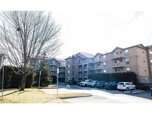 306-1450 Bishops Gate, Oakville, ON - Outdoor With Balcony With Facade