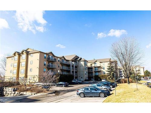 306-1450 Bishops Gate, Oakville, ON - Outdoor With Balcony With Facade