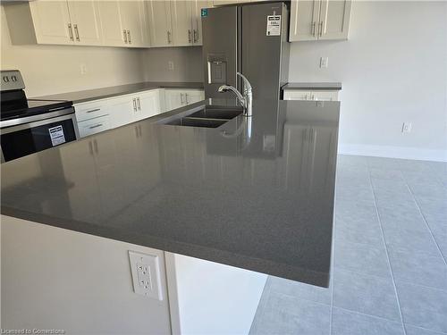 813 Knights Lane, Woodstock, ON - Indoor Photo Showing Kitchen With Double Sink