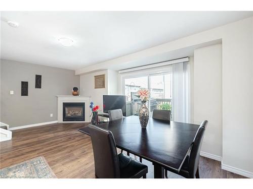 15-26 Poplar Drive, Cambridge, ON - Indoor Photo Showing Dining Room With Fireplace