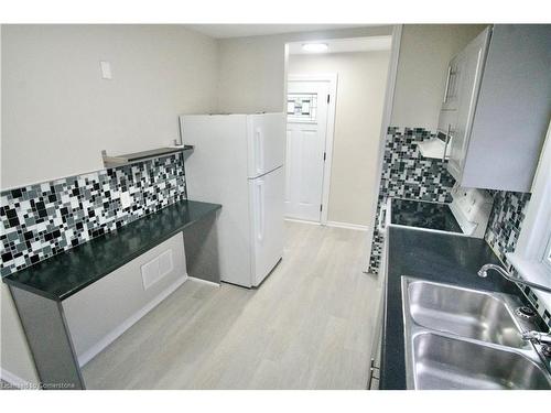 Main-352 East 18Th Street, Hamilton, ON - Indoor Photo Showing Kitchen With Double Sink