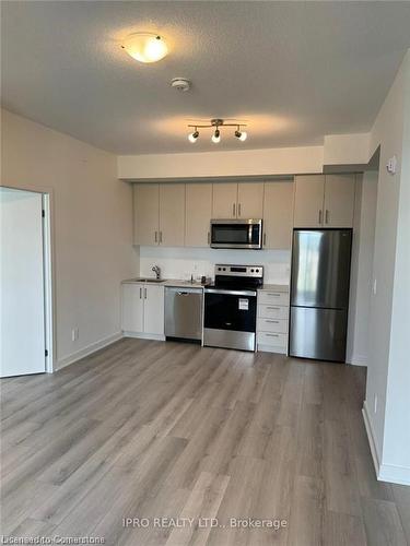 407-1440 Clarriage Court, Milton, ON - Indoor Photo Showing Kitchen With Stainless Steel Kitchen