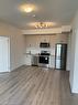 407-1440 Clarriage Court, Milton, ON  - Indoor Photo Showing Kitchen With Stainless Steel Kitchen 