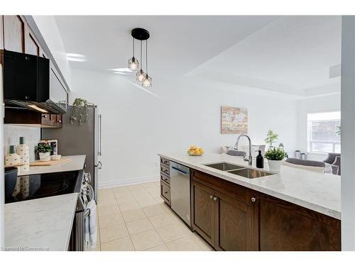 105-5070 Fairview Street, Burlington, ON - Indoor Photo Showing Kitchen With Double Sink