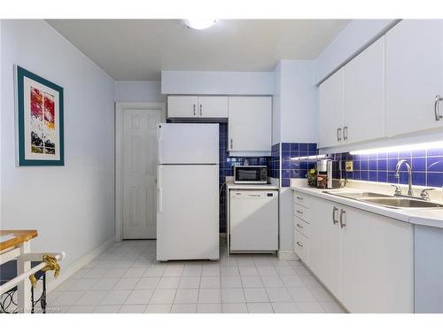 1912-3605 Kariya Drive, Mississauga, ON - Indoor Photo Showing Kitchen With Double Sink