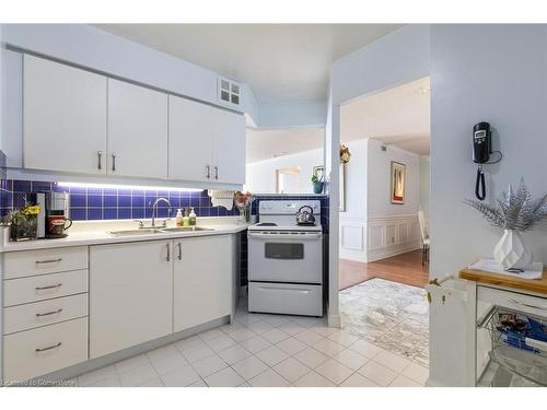 1912-3605 Kariya Drive, Mississauga, ON - Indoor Photo Showing Kitchen With Double Sink