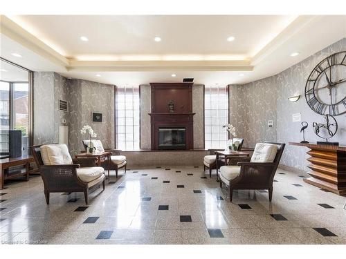 1912-3605 Kariya Drive, Mississauga, ON - Indoor Photo Showing Living Room With Fireplace