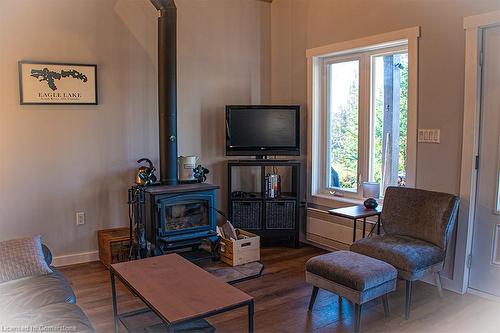 1908 Eagle Lake Road, South River, ON - Indoor Photo Showing Living Room With Fireplace