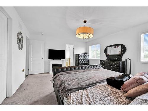 130 Chartwell Circle, Hamilton, ON - Indoor Photo Showing Bedroom With Fireplace