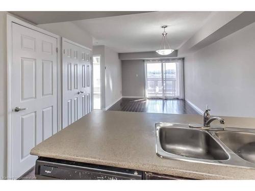 316-3070 Rotary Way, Halton, ON - Indoor Photo Showing Kitchen With Double Sink