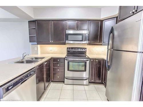 316-3070 Rotary Way, Halton, ON - Indoor Photo Showing Kitchen With Stainless Steel Kitchen With Double Sink