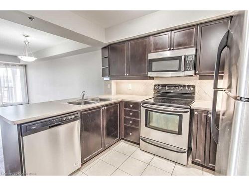 316-3070 Rotary Way, Halton, ON - Indoor Photo Showing Kitchen With Double Sink