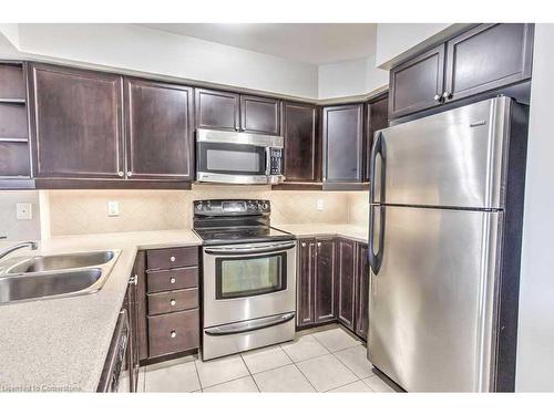 316-3070 Rotary Way, Halton, ON - Indoor Photo Showing Kitchen With Stainless Steel Kitchen With Double Sink