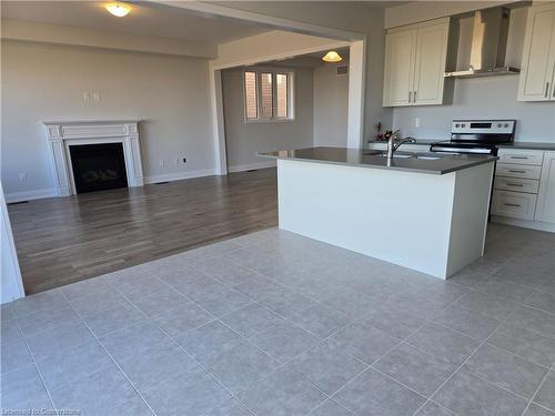 901 Knights Lane, Woodstock, ON - Indoor Photo Showing Kitchen With Fireplace With Double Sink