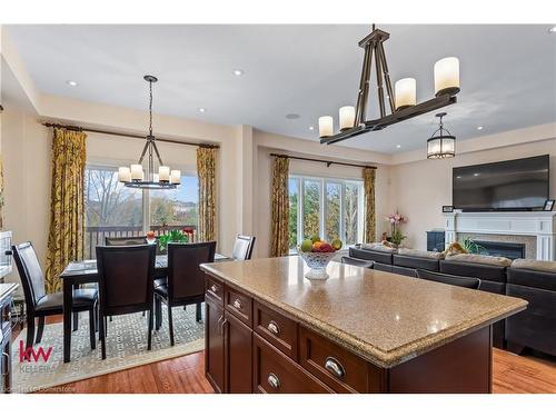 691 Robert Ferrie Drive, Kitchener, ON - Indoor Photo Showing Dining Room With Fireplace