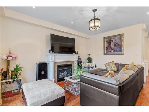 691 Robert Ferrie Drive, Kitchener, ON - Indoor Photo Showing Living Room With Fireplace