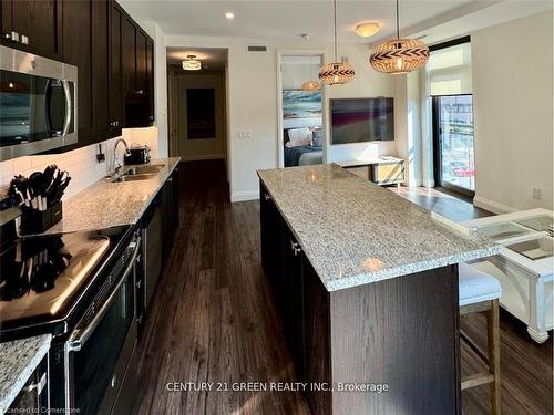 417-118 King Street E, Hamilton, ON - Indoor Photo Showing Kitchen With Double Sink